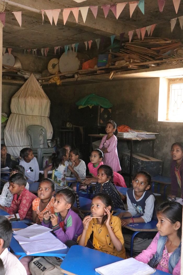 Home A group of children attentively learning in a rural classroom in Banaskantha, India.